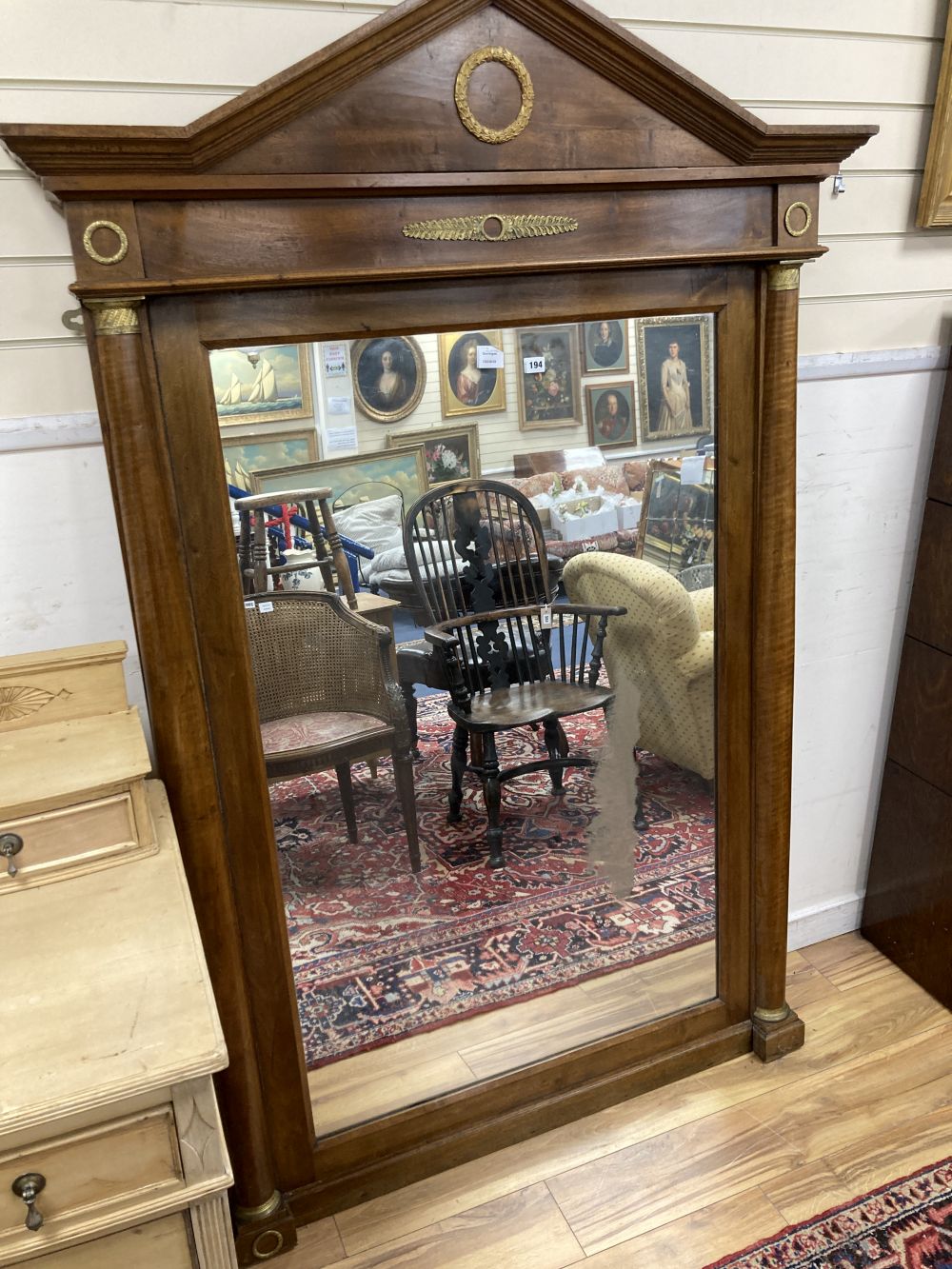 An Empire style mahogany gilt metal mounted overmantel mirror, width 125cm height 190cm